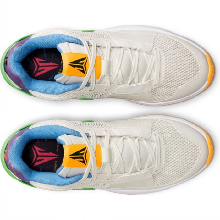 Detailed look at Ja Morant's white and yellow Nike shoes.